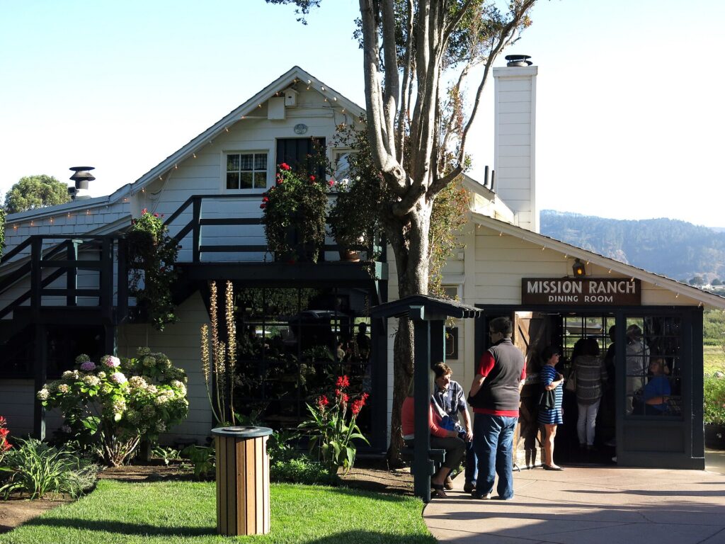 The white farmhouse and barns of Mission Ranch in Carmel-by-the-Sea