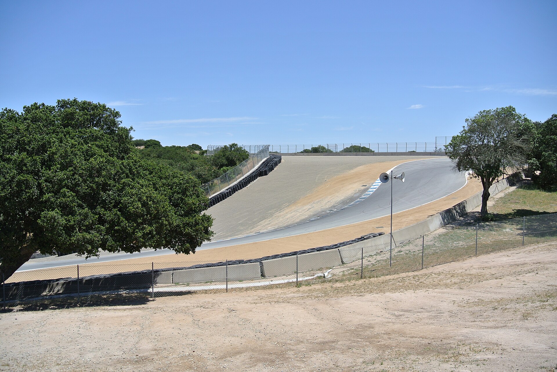 Race cars descending the Corkscrew at WeatherTech Raceway Laguna Seca