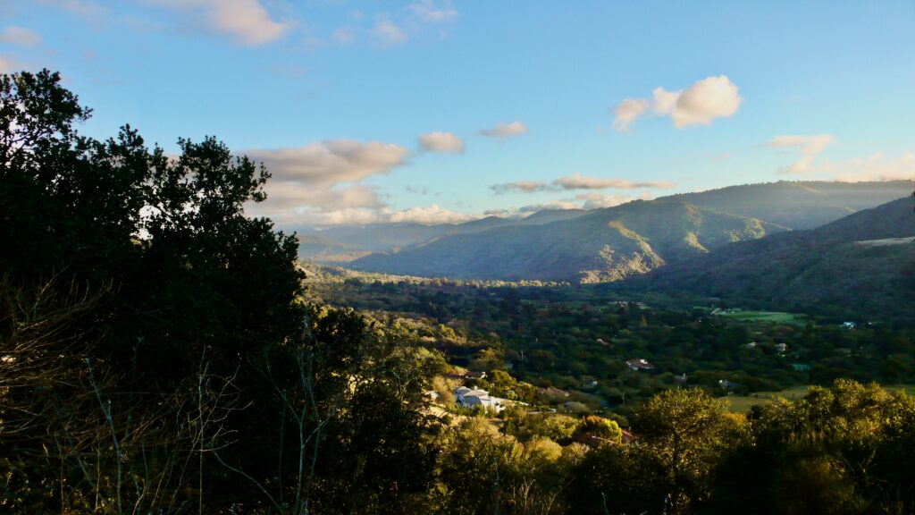 Carmel Valley opening inland beyond the reach of the coastal marine layer.