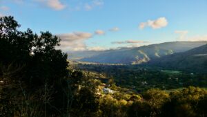 Carmel Valley opening inland beyond the reach of the coastal marine layer.