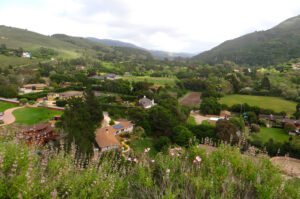 Sun-warmed oak-studded hills rolling across Carmel Valley, California.